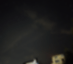 Clouds moving over stars in the night sky